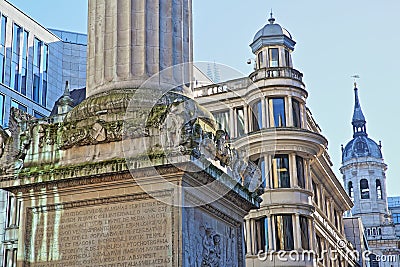 Close-up on the Monument to the great fire in London surrounded by modern buildings in the financial district of the City of Londo Editorial Stock Photo